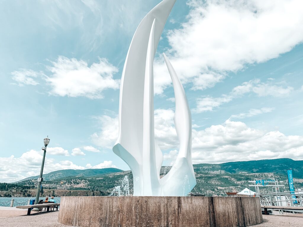 The Kelowna Sails Sculpture in downtown Kelowna, BC by the lake in the Okanagan Valley, a great spot to visit on a longer trip to Big White Ski Resort